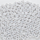 BD00088-02-silver-letter-white-opaque-coin-alphabet-beads-single-e-4×7mm
